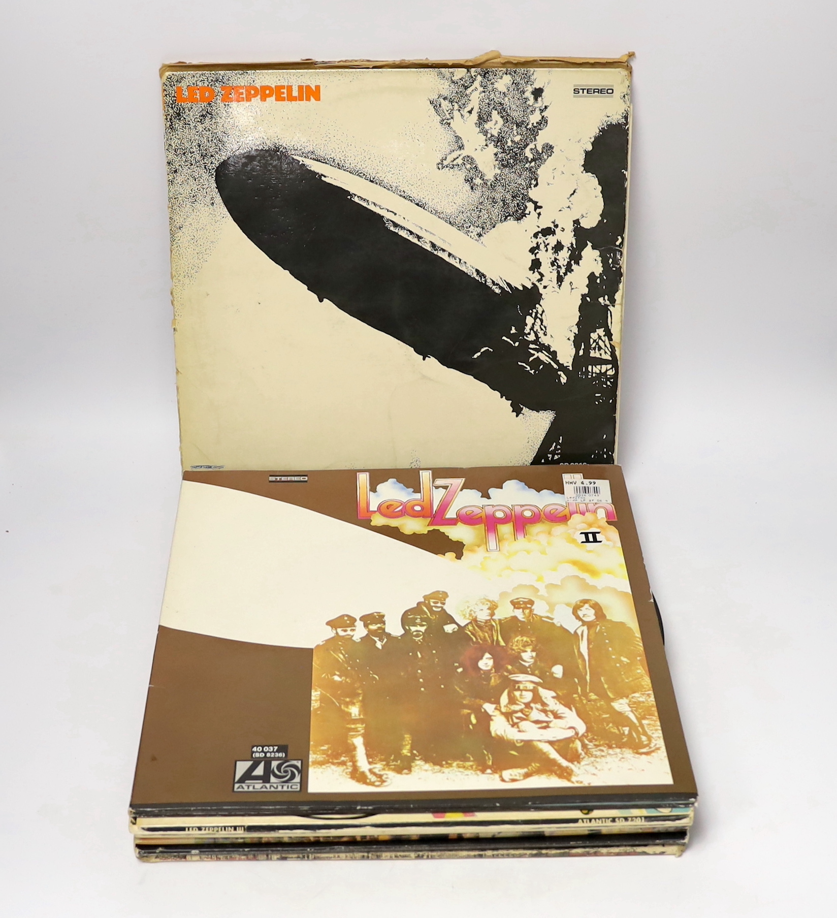 Nine Led Zeppelin LP albums, including; In Through the Out Door, in original brown paper bag, Led Zeppelin, Led Zeppelin II, Led Zeppelin III, Led Zeppelin IV, Presence, Houses of the Holy, The Song Remains the Same, and